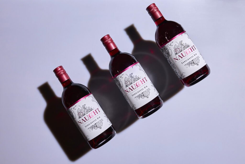 Naught sangiovese gin played out on purple background